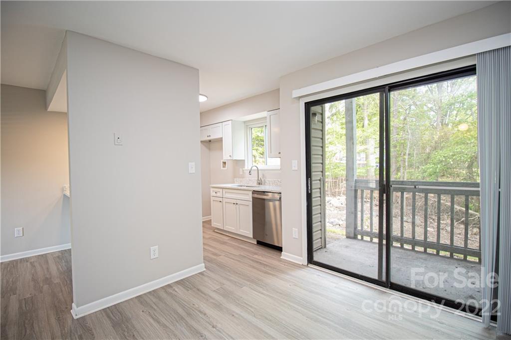 11031 Cedar View Road Charlotte, NC 28226 - Photo 15 of 25 a view of a kitchen from wooden floor and a window