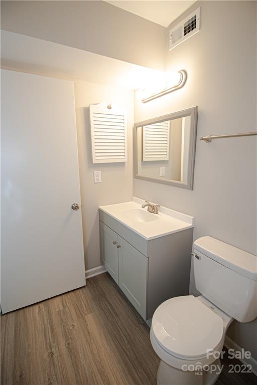 11031 Cedar View Road Charlotte, NC 28226 - Photo 18 of 25 a bathroom with a toilet sink and mirror
