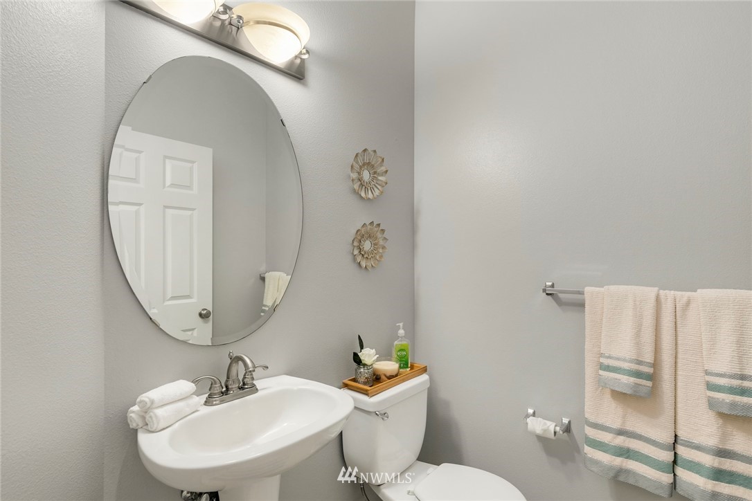 6128 Southeast 3rd Place Renton, WA 98059 - Photo 14 of 28 a bathroom with a sink mirror and toilet