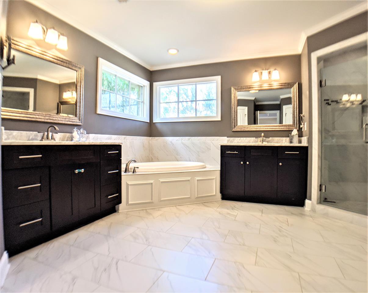 4444 Princeton Road Memphis, TN 38117 - Photo 15 of 25 Luxury master bath with jetted tub and shower. Separate sinks and his & hers custom closets.