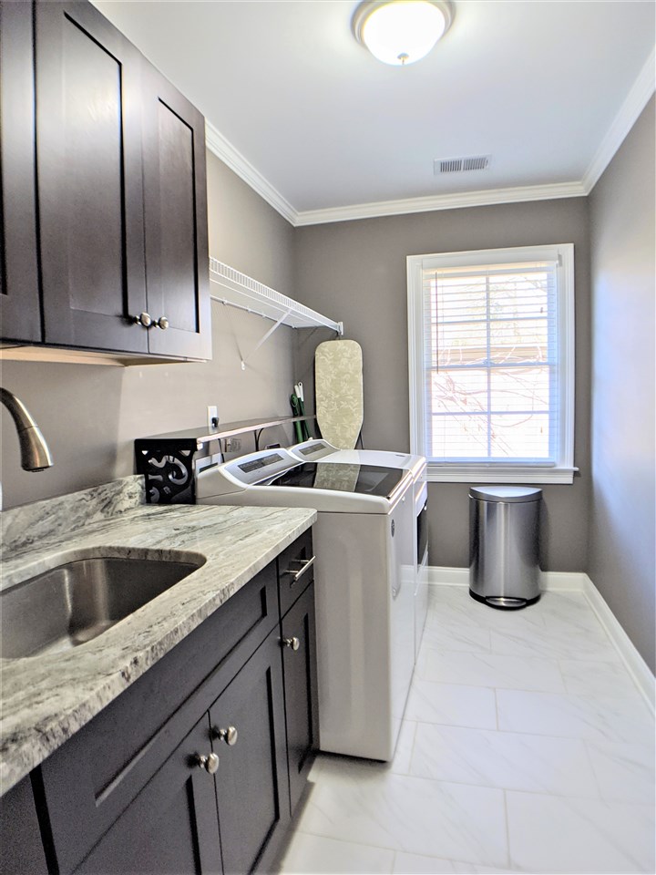 4444 Princeton Road Memphis, TN 38117 - Photo 23 of 25 Large Laundry Room with cabinet storage and sink