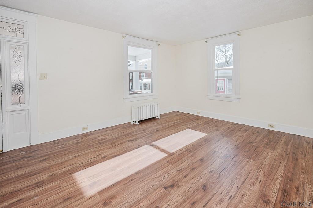 159 Wilson Street Johnstown, PA 15906 - Photo 6 of 27 a view of empty room with wooden floor and fan
