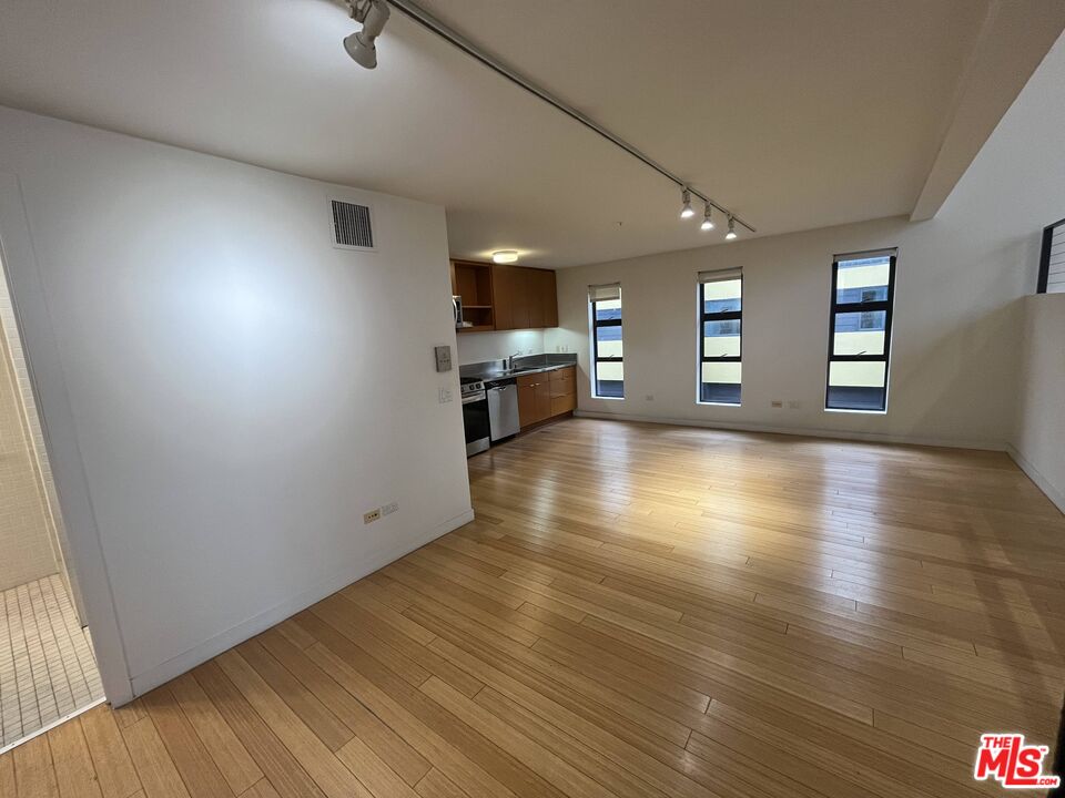 320 Indiana Avenue, Unit A Venice, CA 90291 - Photo 13 of 24 wooden floor in an empty room with a window