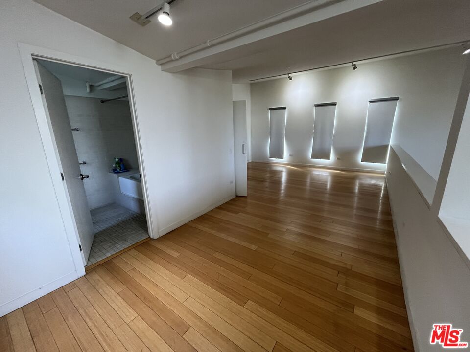 320 Indiana Avenue, Unit A Venice, CA 90291 - Photo 19 of 24 a view of a hallway with wooden floor