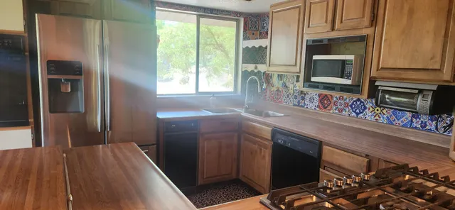 a view of an empty room with large windows