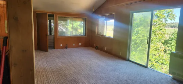 a view of house with a tree