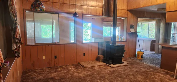 a view of a room with furniture and windows