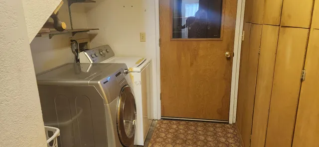 a bathroom with a sink a toilet and a window