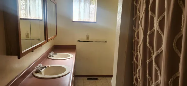 a bathroom with a shower curtain