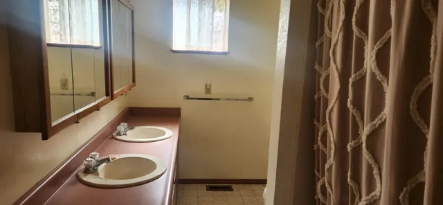 a bathroom with a shower curtain