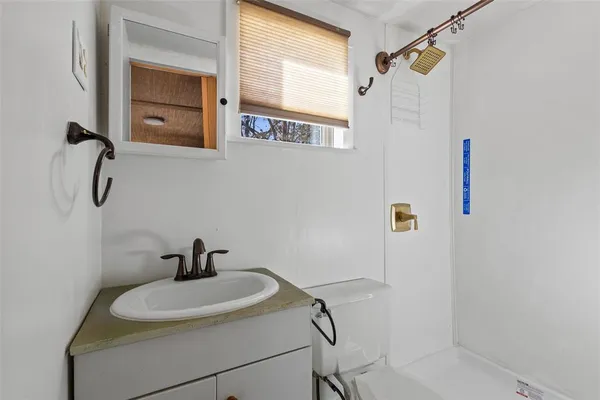 a bathroom with a sink and mirror