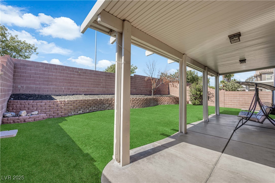 9005 Rendon Street Las Vegas, NV 89143 - Photo 41 of 51 Fenced backyard with a patio area