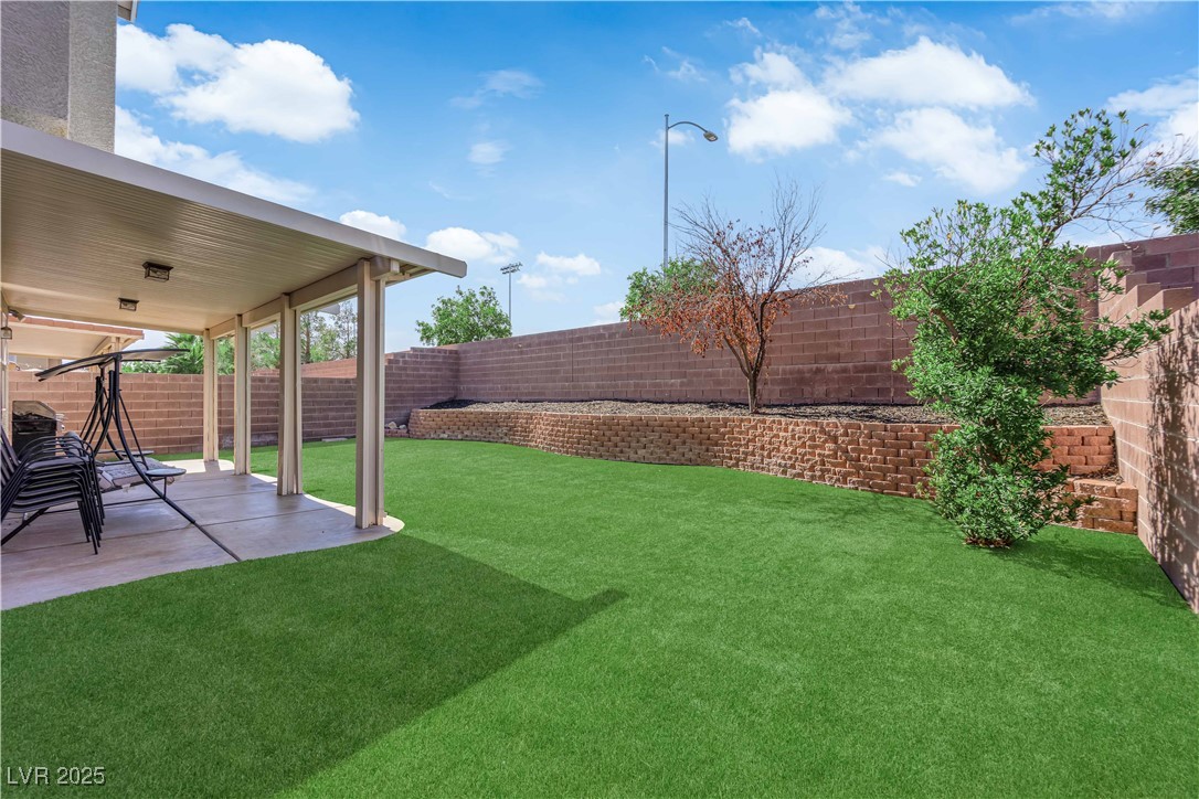 9005 Rendon Street Las Vegas, NV 89143 - Photo 44 of 51 Fenced backyard featuring a patio