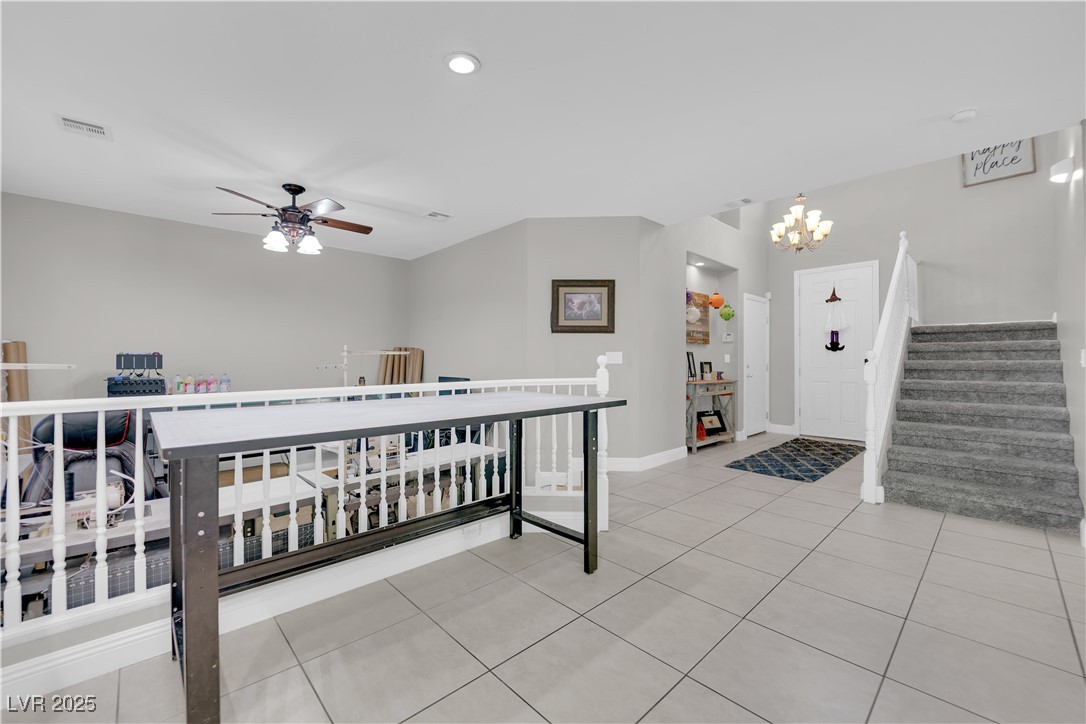 9005 Rendon Street Las Vegas, NV 89143 - Photo 5 of 51 Foyer with light tile patterned floors, stairway, ceiling fan, a chandelier, and recessed lighting