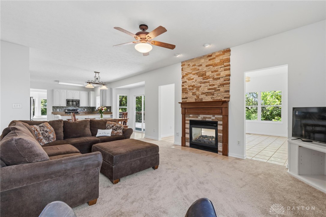 70 Martin Lane Springboro, OH 45066 - Photo 19 of 69 This inviting living area boasts a warm fireplace, creating a cozy ambiance for gatherings.