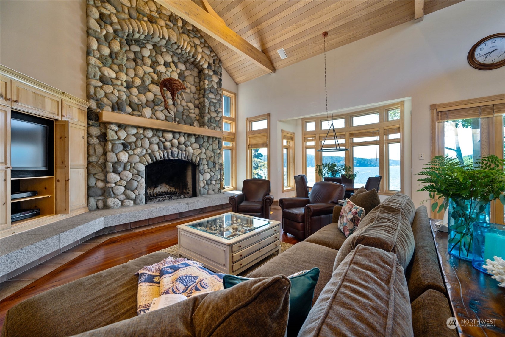 15215 Gibralter Road Anacortes, WA 98221 - Photo 11 of 40 a living room with furniture and a fireplace
