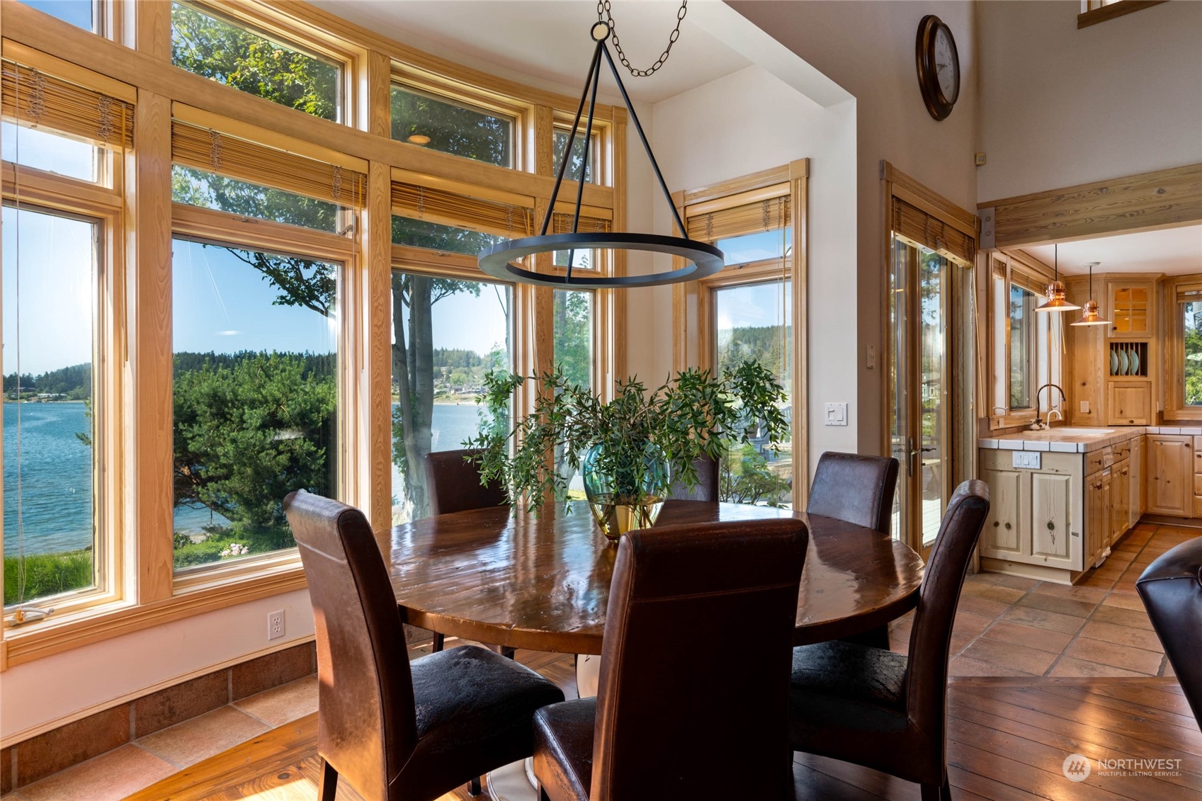 15215 Gibralter Road Anacortes, WA 98221 - Photo 14 of 40 a dining room with furniture window and wooden floor