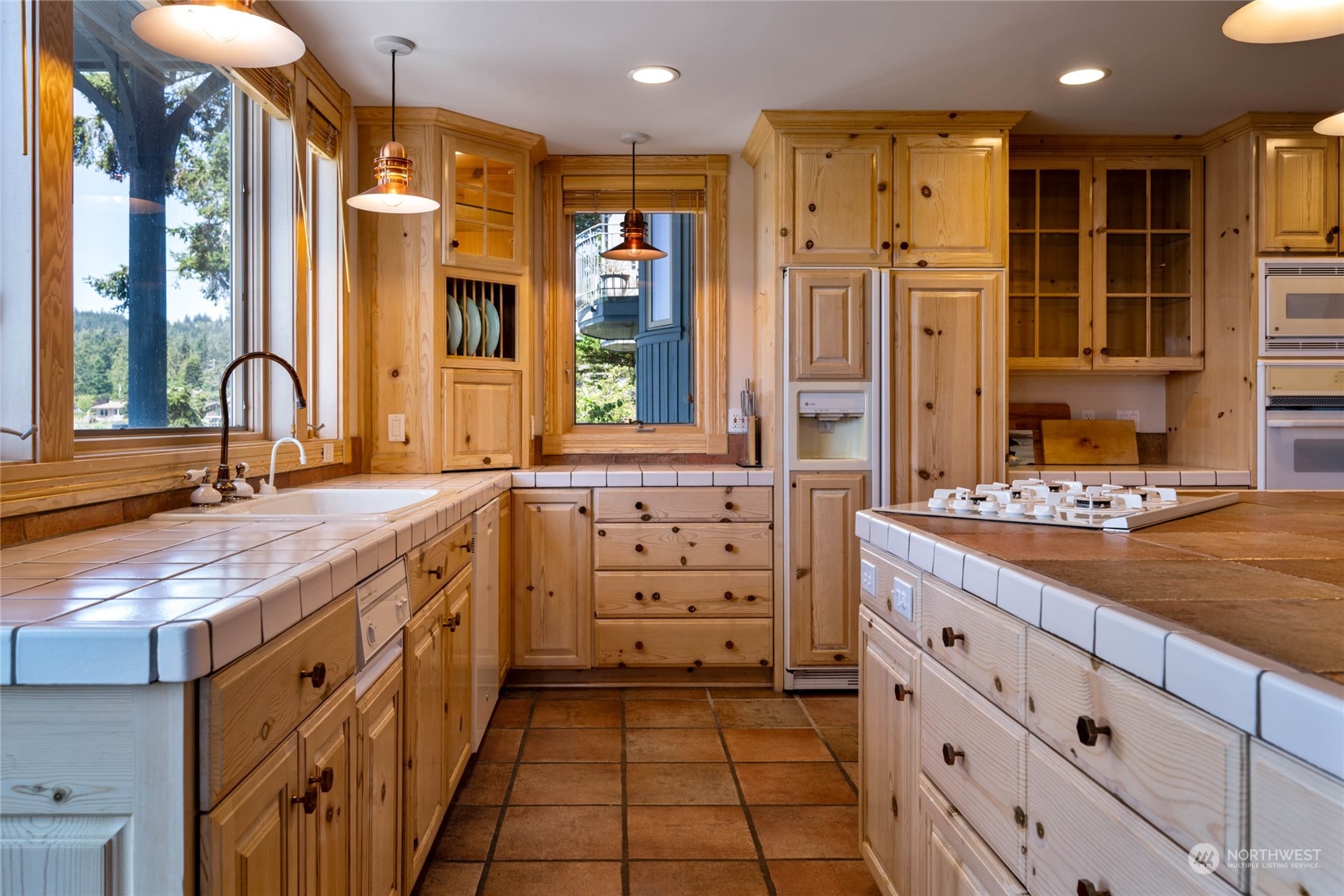 15215 Gibralter Road Anacortes, WA 98221 - Photo 15 of 40 a bathroom with a double vanity sink a mirror and a shower