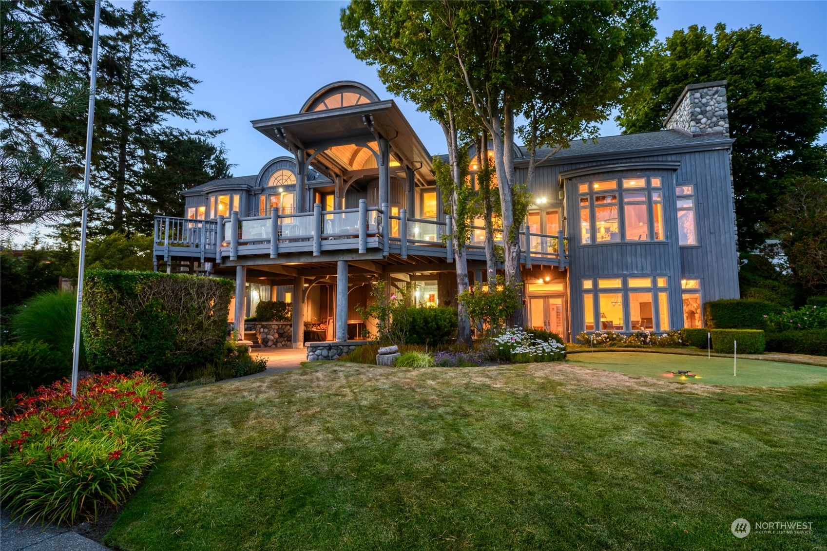 15215 Gibralter Road Anacortes, WA 98221 - Photo 2 of 40 a view of a building with a yard