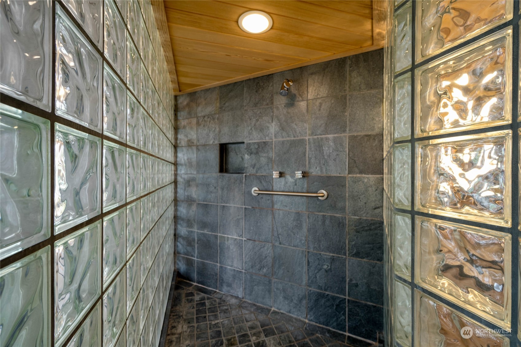 15215 Gibralter Road Anacortes, WA 98221 - Photo 27 of 40 a bathroom with a shower