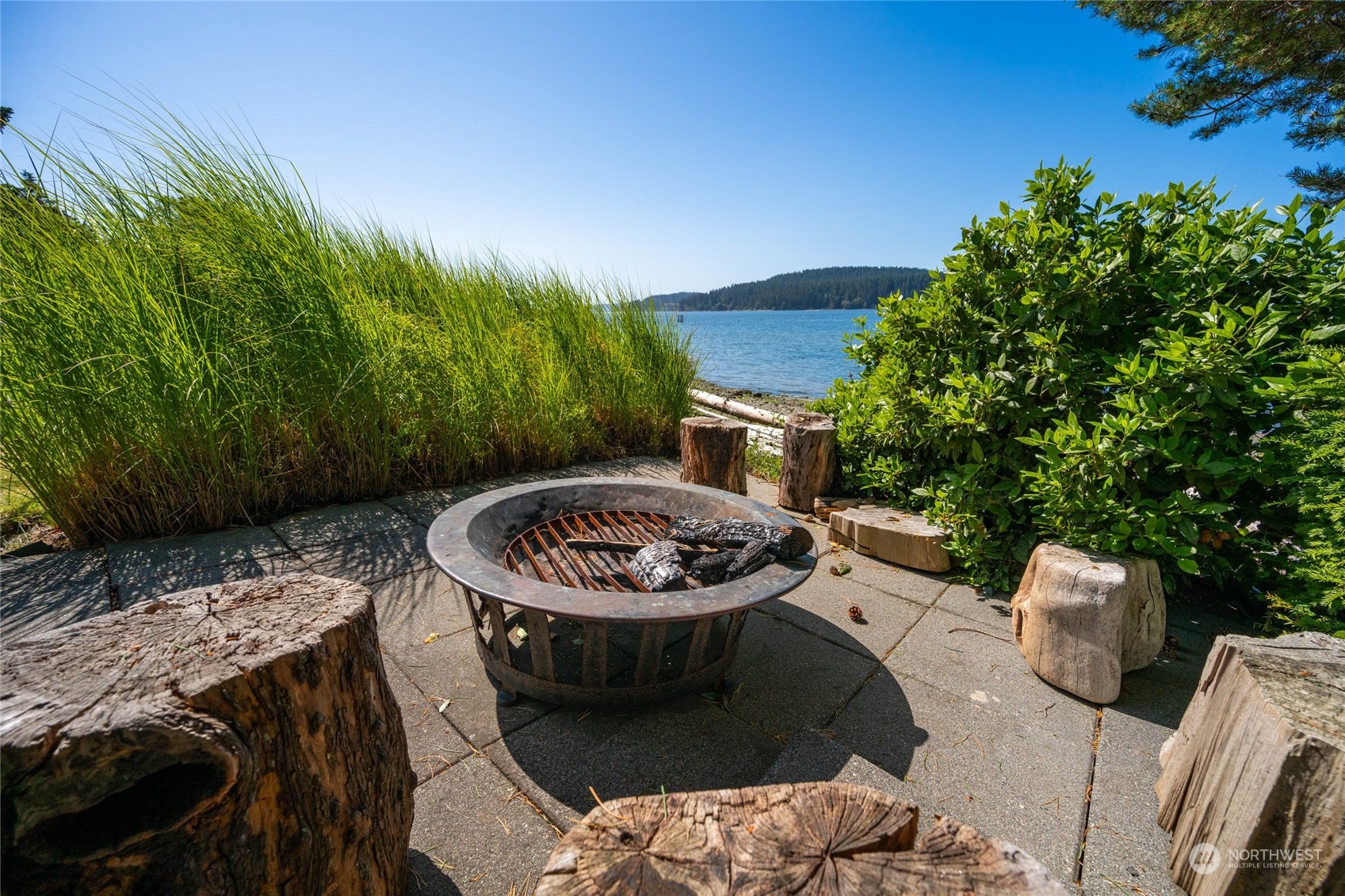 15215 Gibralter Road Anacortes, WA 98221 - Photo 32 of 40 a view of a backyard with sitting area