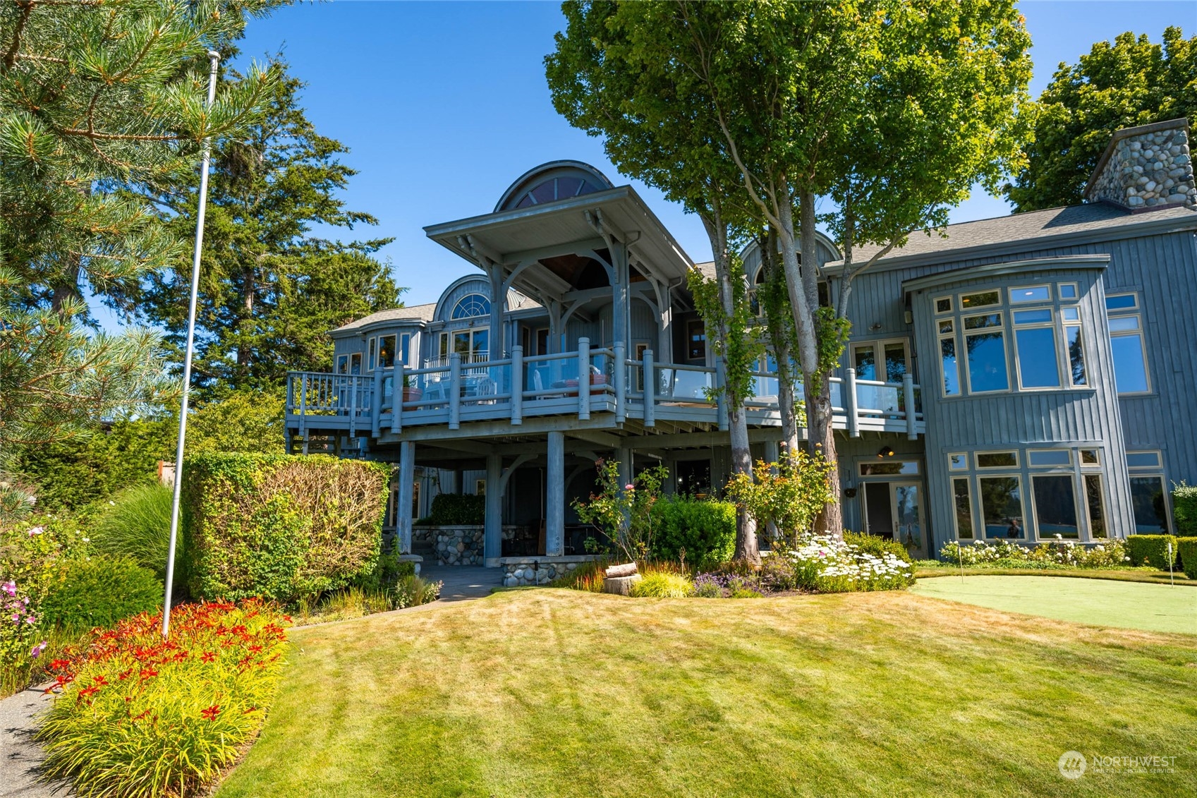 15215 Gibralter Road Anacortes, WA 98221 - Photo 39 of 40 a front view of a house with a yard