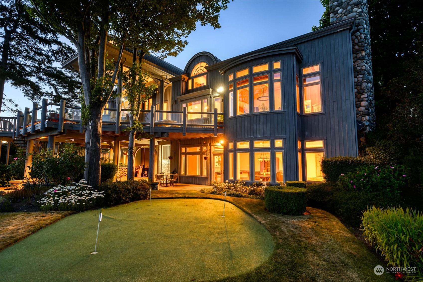15215 Gibralter Road Anacortes, WA 98221 - Photo 7 of 40 a view of swimming pool with a garden