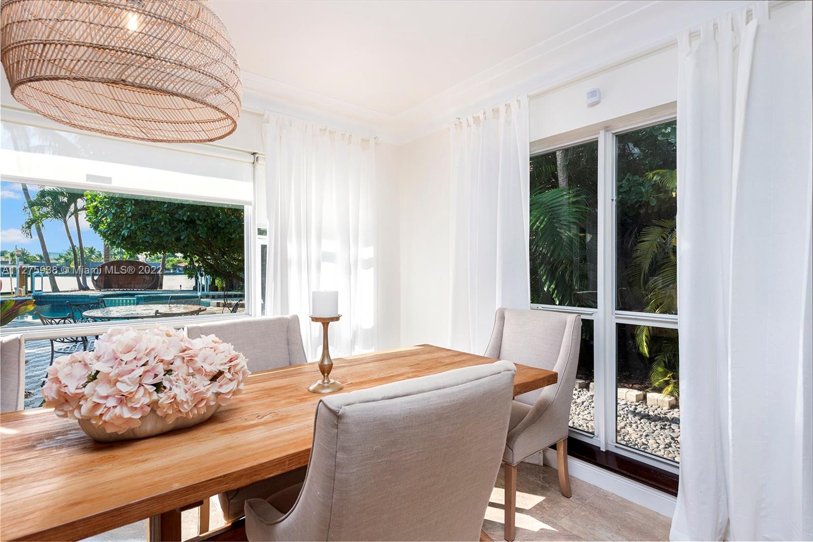 940 88th Street Surfside, FL 33154 - Photo 18 of 38 a bedroom with furniture and a window