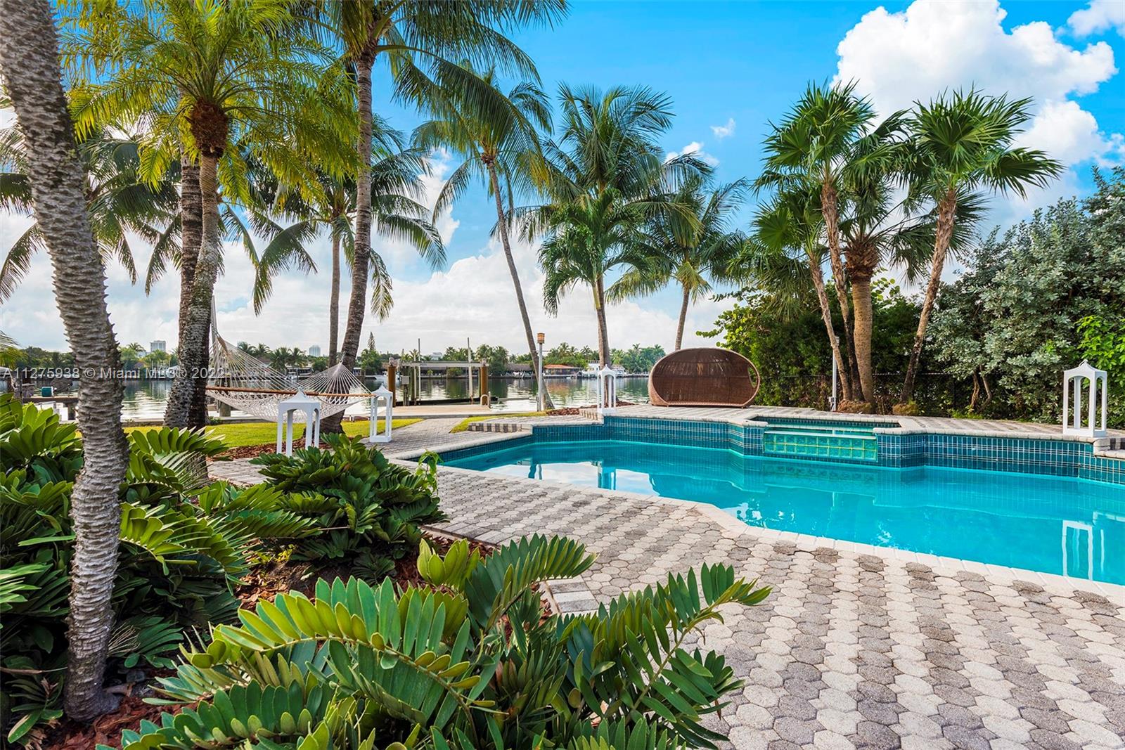 940 88th Street Surfside, FL 33154 - Photo 2 of 38 a view of a yard with palm trees