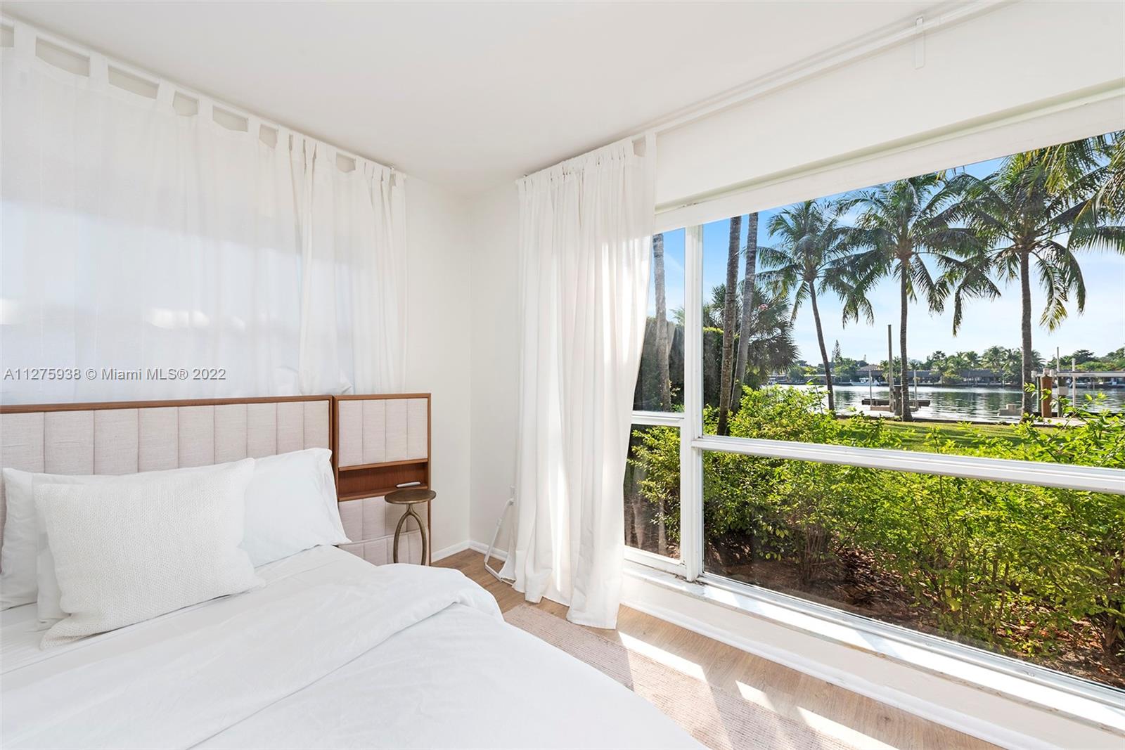 940 88th Street Surfside, FL 33154 - Photo 32 of 38 a view of a living room and a balcony