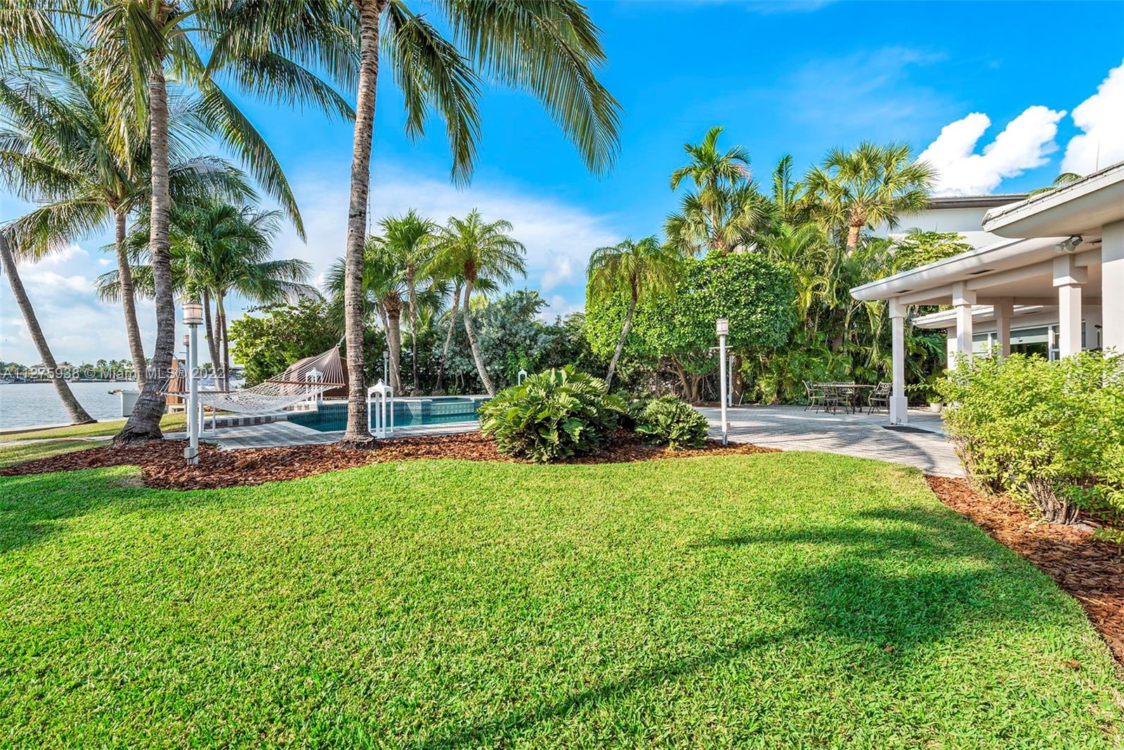 940 88th Street Surfside, FL 33154 - Photo 6 of 38 a view of a garden with a tree