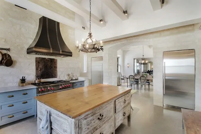 a living room with stainless steel appliances kitchen island granite countertop furniture and a kitchen view