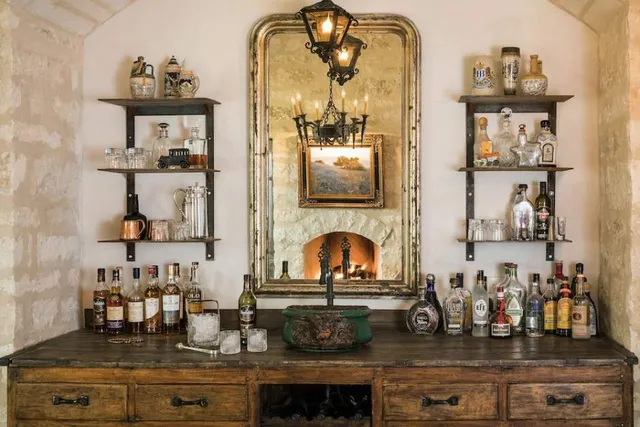 a bathroom with a toilet a sink a mirror and a shower