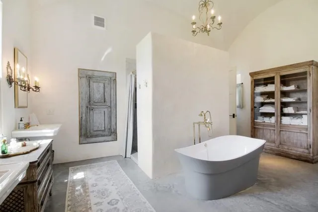 a bathroom with a tub and a sink