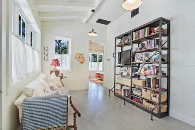 a view of a house with yard and tree s