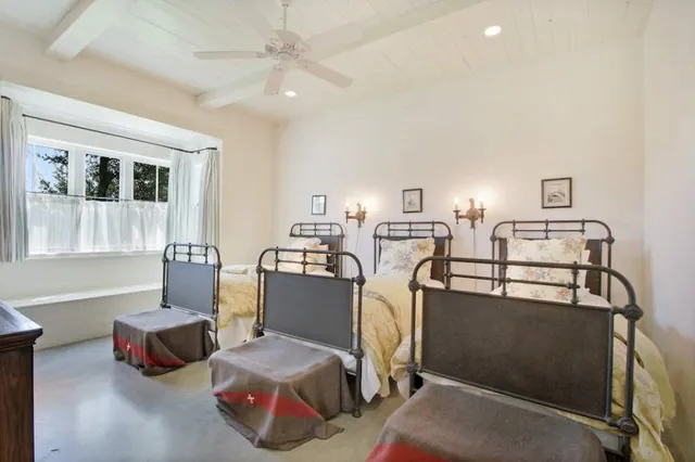 a kitchen with a stove and white cabinets