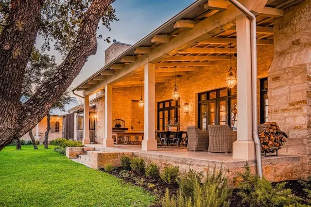a bathroom with a granite countertop bathtub shower sink and toilet
