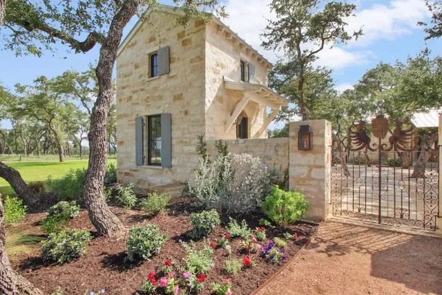 a huge green field with lots of trees