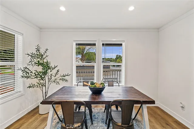 a view of a room with a table and chairs