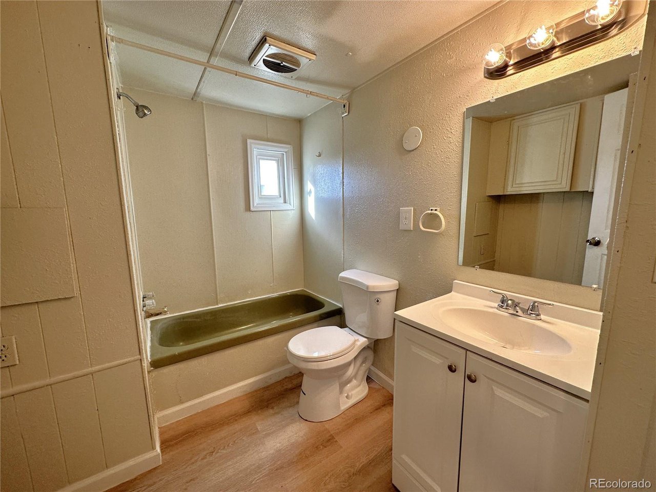 155 Indiana Avenue Limon, CO 80828 - Photo 18 of 27 a bathroom with a sink a toilet and shower