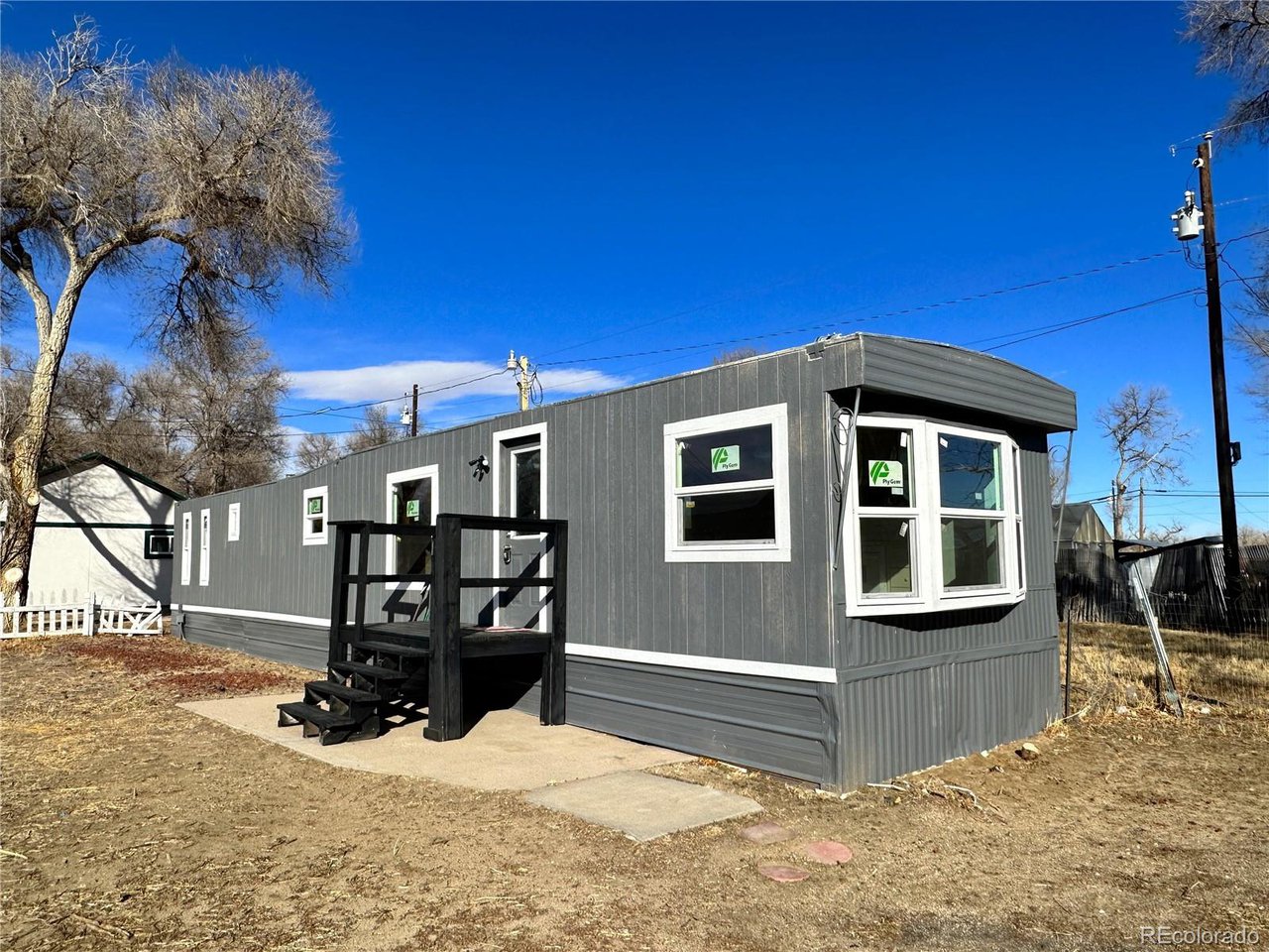 155 Indiana Avenue Limon, CO 80828 - Photo 2 of 27 a view of a house with a yard