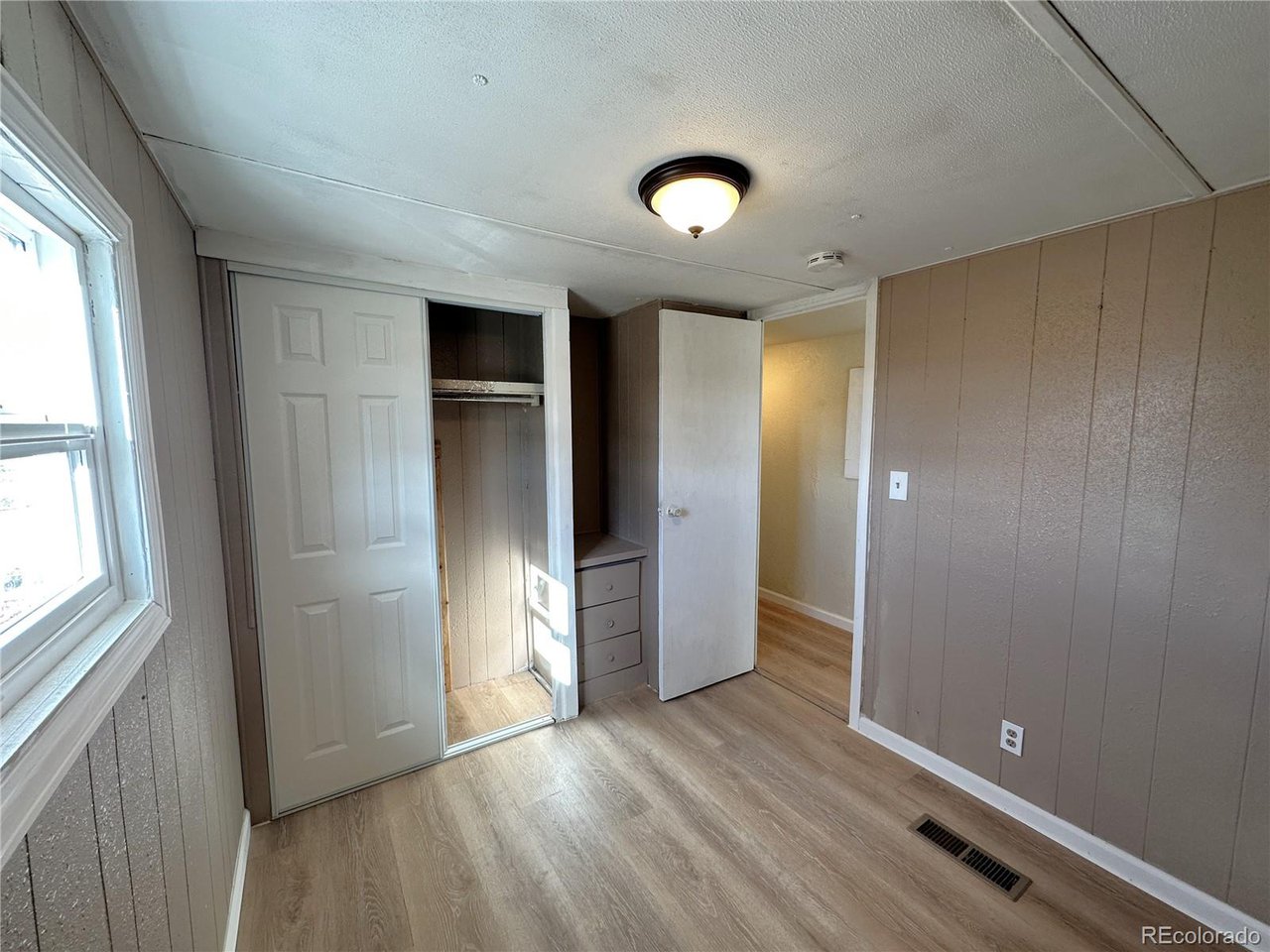 155 Indiana Avenue Limon, CO 80828 - Photo 21 of 27 an empty room with closet and windows