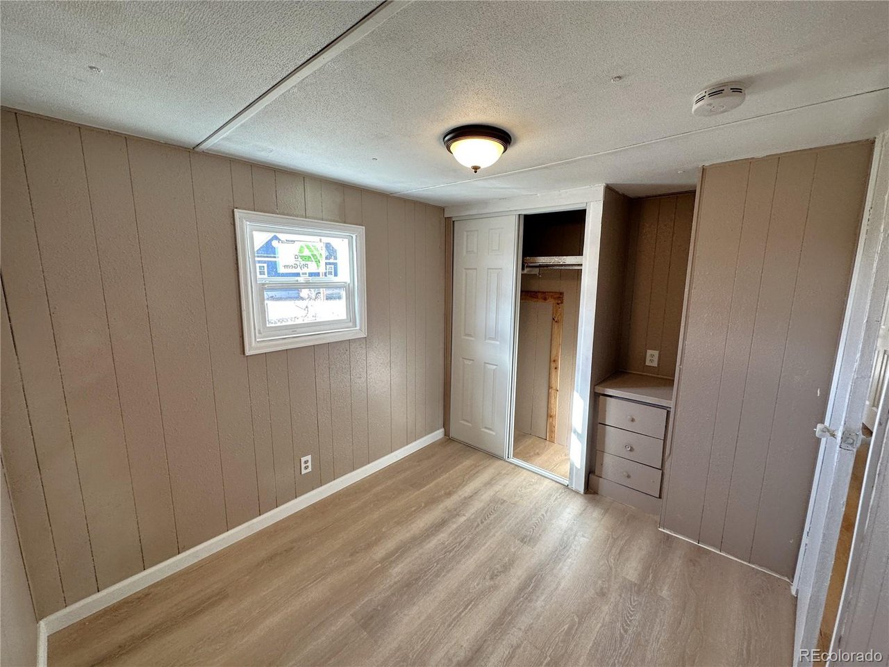 155 Indiana Avenue Limon, CO 80828 - Photo 22 of 27 an empty room with closet and windows