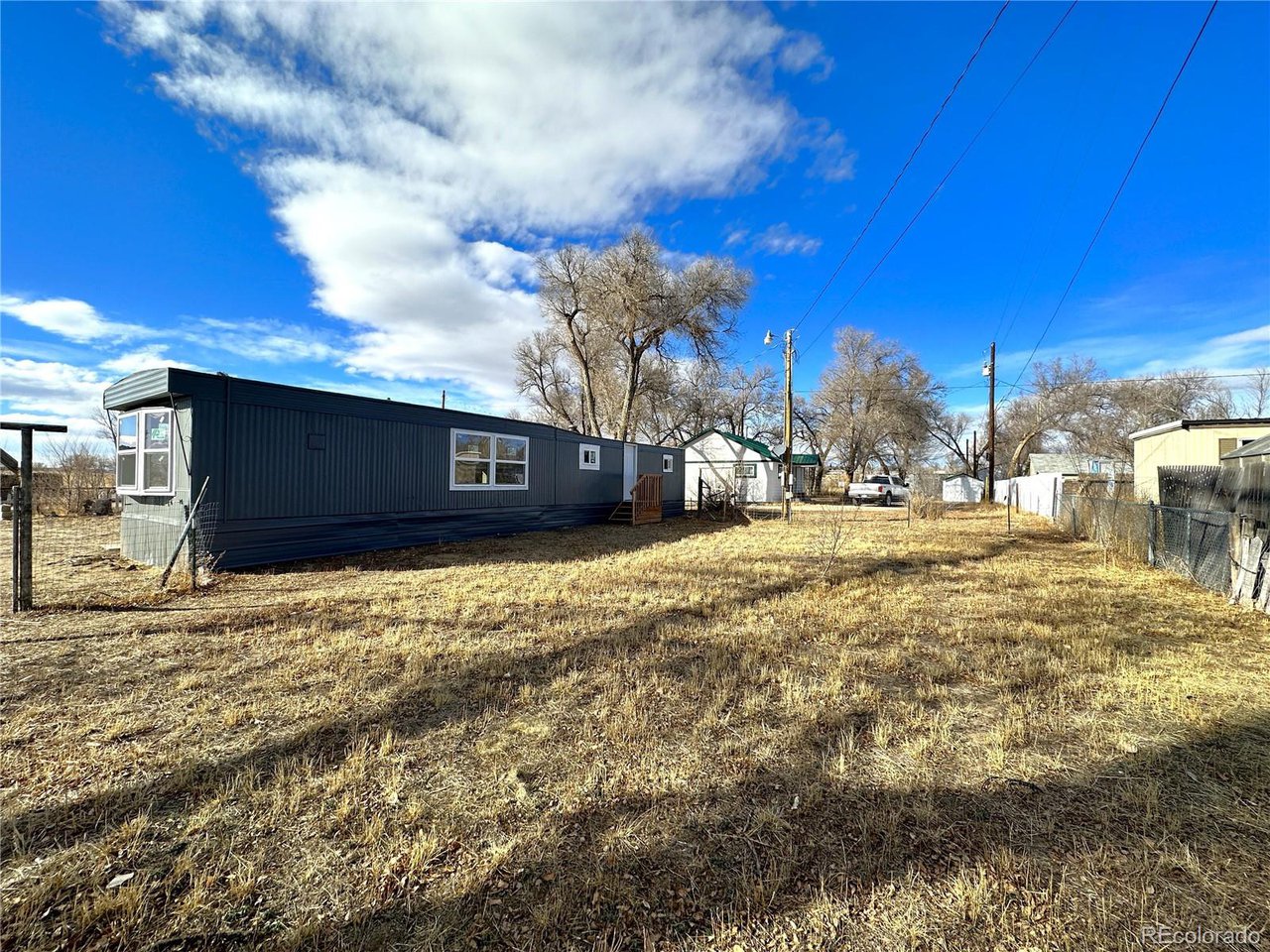155 Indiana Avenue Limon, CO 80828 - Photo 24 of 27 a view of a house with a yard
