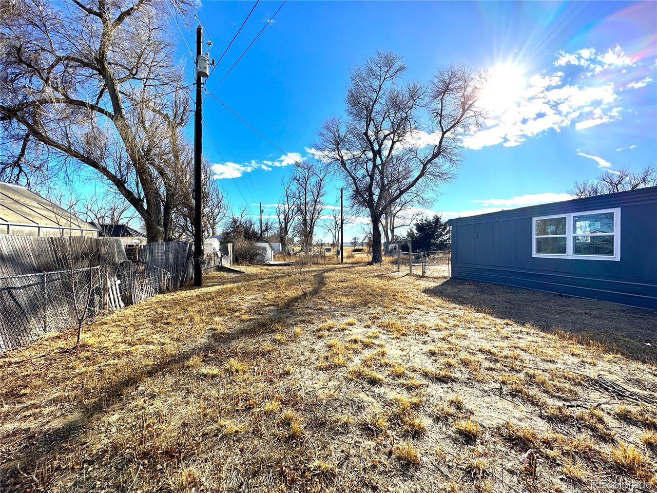 155 Indiana Avenue Limon, CO 80828 - Photo 26 of 27 a view of a yard with a large tree