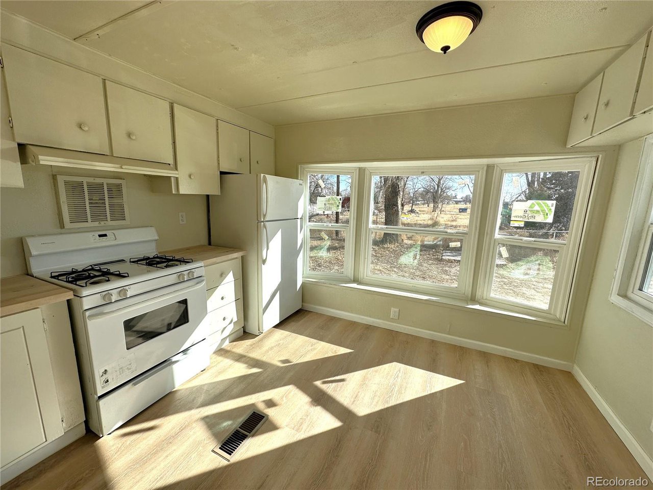 155 Indiana Avenue Limon, CO 80828 - Photo 6 of 27 a kitchen with stainless steel appliances granite countertop a stove a sink and a refrigerator