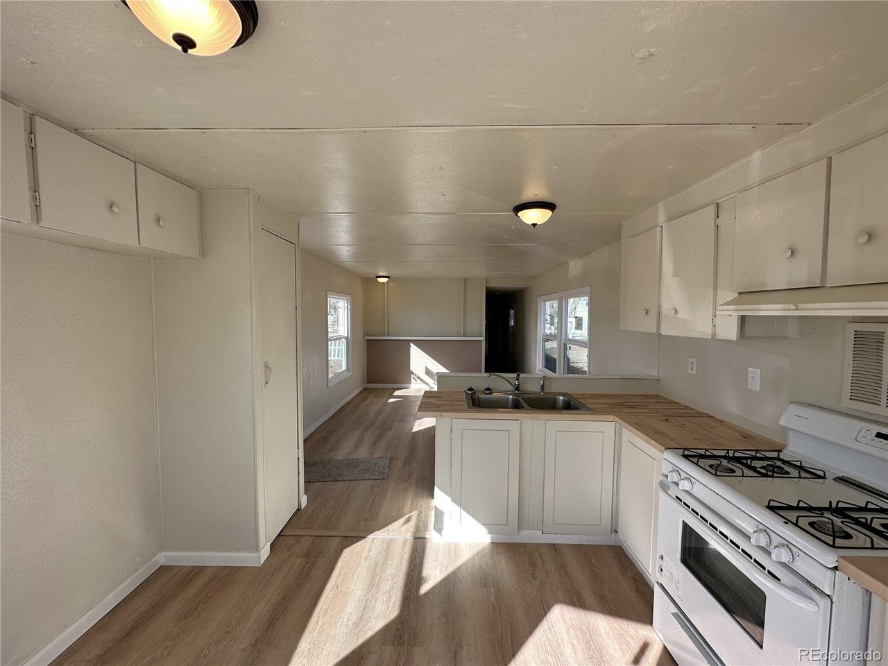 155 Indiana Avenue Limon, CO 80828 - Photo 9 of 27 a kitchen with a sink stainless steel appliances and cabinets