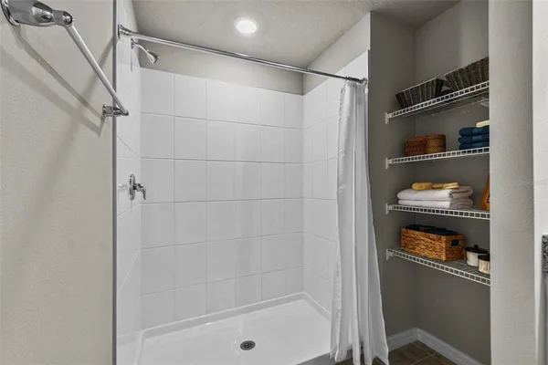 a bathroom with a bathtub and a shower