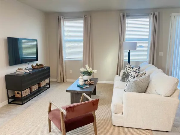 a view of workspace filled with furniture and window