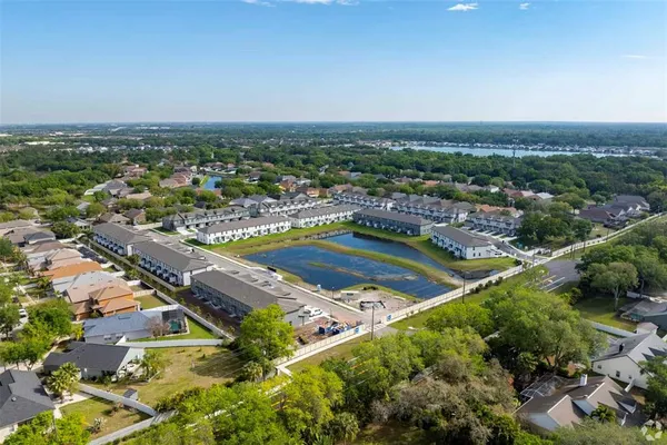 an aerial view of residential houses with outdoor space